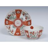 A Worcester Scarlet Japan pattern fluted tea bowl and saucer,