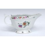 A Worcester strap fluted sauce boat, painted with brightly coloured flower sprays,