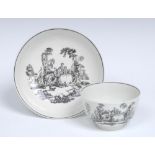 A Worcester L'Amour pattern tea bowl and saucer, after an engraving by Robert Hancock,