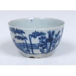 A Worcester The Plantation pattern tea bowl, painted in underglaze blue with huts, landscape,