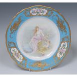 A Royal Worcester shaped circular plate, painted with a classical lady and cherub by a lake,