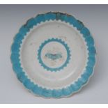 A Worcester shaped circular plate, painted to centre with stylised flower,