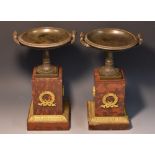 A pair of 19th century dark patinated bronze half-fluted saucer shaped mantel comports,