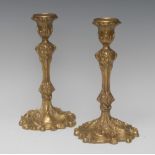 A pair of Rococo gilt bronze table candlesticks,