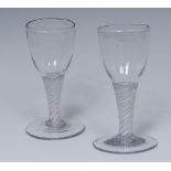 A pair of George III opaque twist wine glasses, ovoid bowls, double-helix stems,