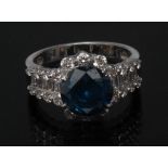 A fancy blue green and white diamond ring, central round cut blue/green diamond approx 3.