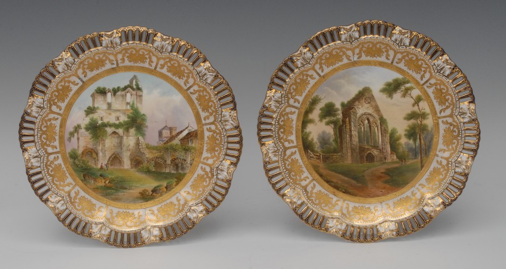 A pair of Coalport shaped circular plates, with pierced border,