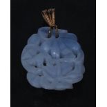 A carved blue grey stone pendant, tiger beneath trees,