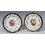 A Royal Worcester shaped circular plate, painted by Ernest Phillips, with ripe fruit,