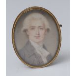 An early 19th century miniature, of a wigged gentleman, wearing a white stock and grey jacket,
