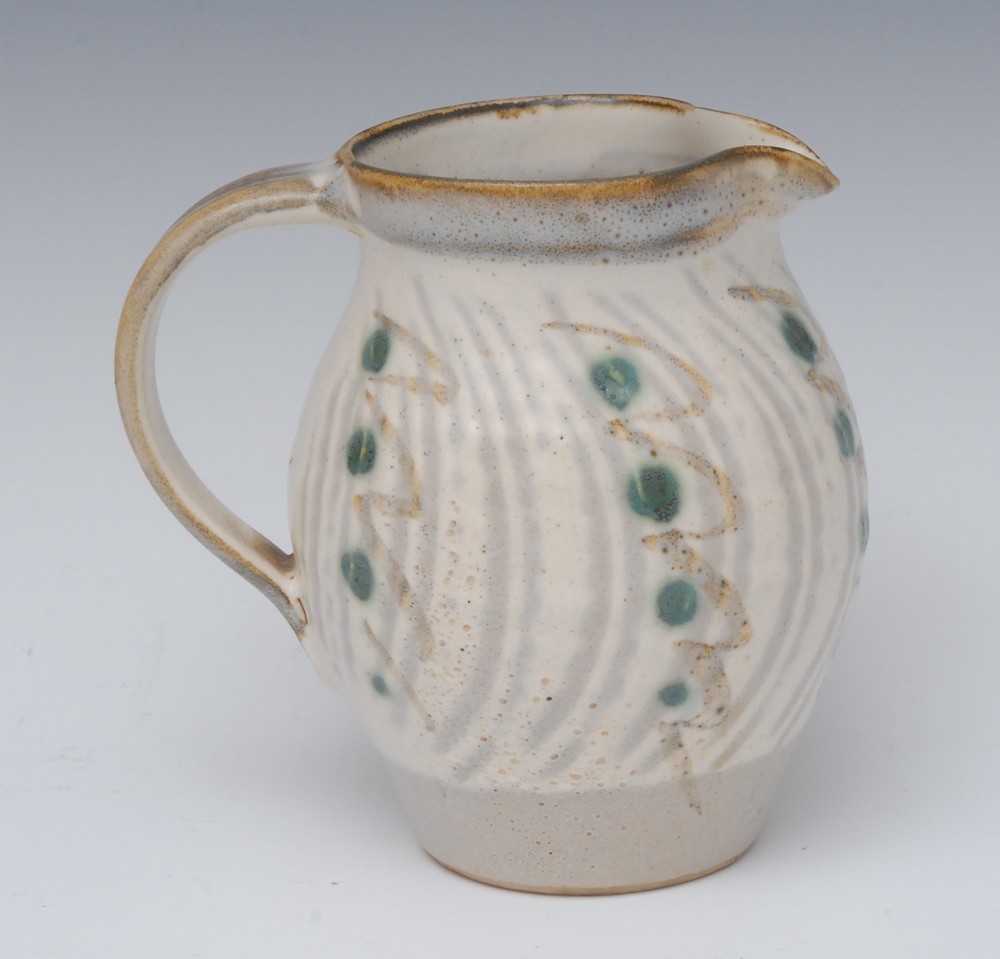 Michael Leach (British 1913 - 1985), a stoneware jug, decorated with green dots and hue wavy bands,