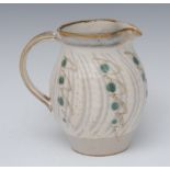 Michael Leach (British 1913 - 1985), a stoneware jug, decorated with green dots and hue wavy bands,