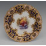 A Royal Worcester shaped circular plate, painted by Richard Seabright, signed,