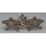 A 19th century Continental silver double salt, cast in the Rococo taste as a pair of shells,