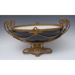 A large French ormolu mounted two-handled boat shaped centrepiece, possibly Sevres, in Bleu Royale,