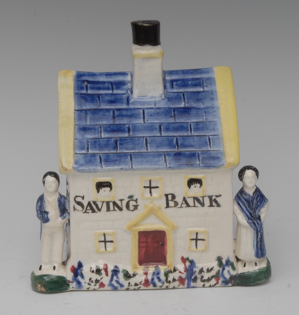 A South Yorkshire cottage money bank, decorated in the typical Pratt ware/Pearlware manner,