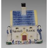 A South Yorkshire cottage money bank, decorated in the typical Pratt ware/Pearlware manner,