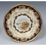 A Coalport shaped circular plate, painted by P.
