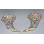 A pair of Continental cornucopia wall pockets,