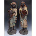 A large pair of early 20th century Austrian earthenware figures, of Nubian Water Carriers,