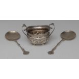 A Victorian silver two-handle sugar basin, chased with flowers and foliage, bun feet, 13cm wide,