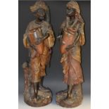 A large pair of early 20th century Austrian terracotta figures, of Nubian Water Carriers,