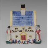 A South Yorkshire cottage money bank, with tiled cobalt blue roof,