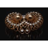 A Contemporary Design diamond owl eyes brooch, graduated looping wire work ring body,