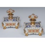 A pair of French square inkwells and stoppers,