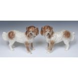 A pair of Staffordshire dogs, standing to the left and right, glass eyes, painted black features,