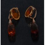 A pair of orange red garnet torpedo drop earrings,