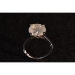 A large diamond solitaire ring, round brilliant cut diamond, measuring approx 10.48 x 7.