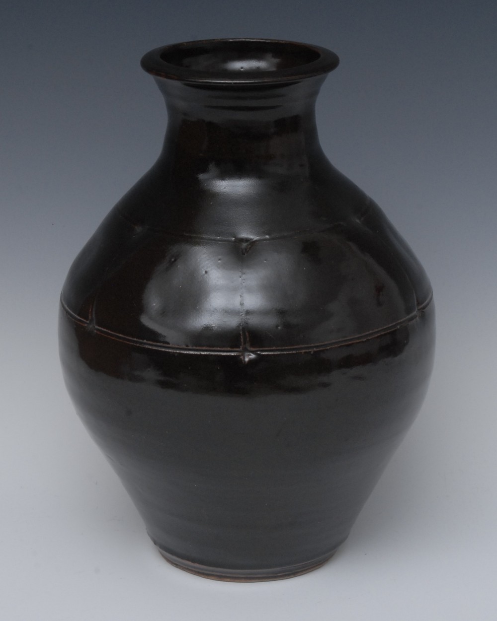 Geoffrey Whiting (British, 1919 -1988), a stoneware vase, with ich tenmoku glaze, incised in lines,