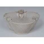 A Belleek trefoil three-stand basket, rope twist border applied with three flowers sprigs,