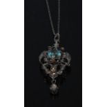 A Victorian pale blue stone and diamond pendant brooch necklace, central round cut blue stone,