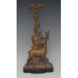 A Victorian cast iron and brass door porter, cast as a stag,