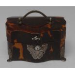 An early 19th century silver-mounted tortoiseshell serpentine commode shaped lady's etui,