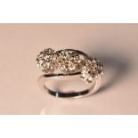 A diamond triple head cluster ring, each floral head inset with seven round brilliant cut diamonds,