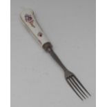 A Chelsea fork , the haft pained with Meissen type flowers, steel prongs, c.