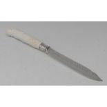 A Chelsea blanc de chine moulded knife handle, in relief with foliate scrolls,