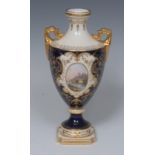 A Coalport two-handed pedestal ovoid vase, painted with a landscape within a gilded oval cartouche,