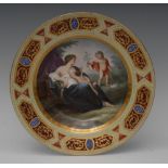 A Vienna circular plate, decorated with a classical figure and two cherubs,