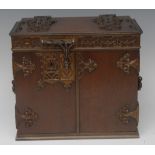 A Victorian Gothic Revival brass-mounted oak table-top cabinet,