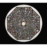 A pietra dura circular table top, inlaid with radiating bands of specimen marble lozenges,