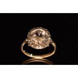 A diamond ring, central oval old cut diamond measuring approx 10.22 x 9.90 x 3.18mm, approx 2.