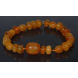 A single strand amber bead necklace,