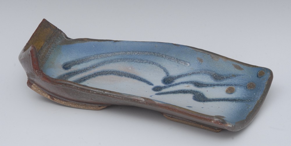 Jim Robinson (British Cotemporary), a stoneware free form dish, in mottled blue, 31cm wide,