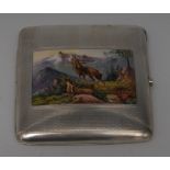 A Continental silver and enamel curved rounded rectangular cigarette case,