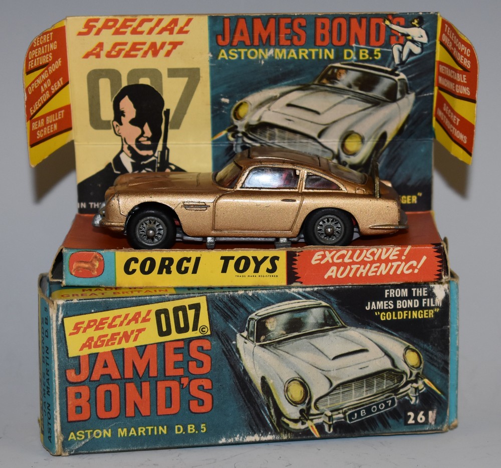 Corgi Toys - 261 James Bond Aston Martin D B 5 from the Film "Goldfinger", metallic gold body,