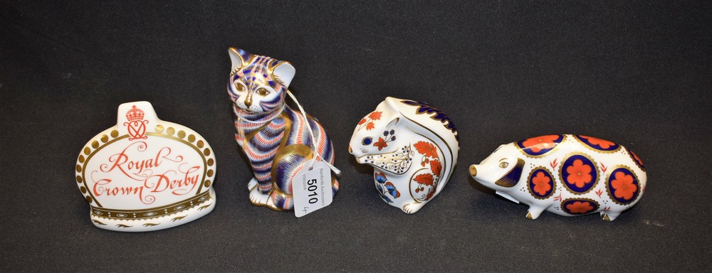 A Royal Crown Derby paperweight, Cat, gold stopper; others, Pig, solid stopper; Squirrel,